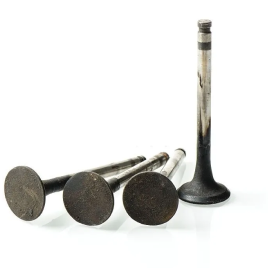 Cleaning valves with walnut chips